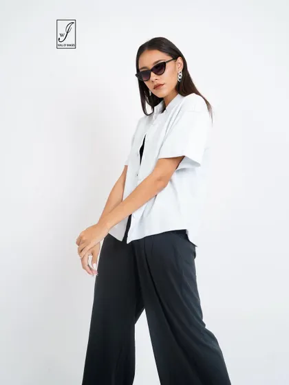 A dynamic pose that adds movement and interest to a standard e-commerce shot.