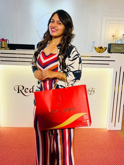 A happy client visiting the studio for a bit of birthday shopping. It brings me so much joy to see my clients leave with a smile and a signature red shopping bag.