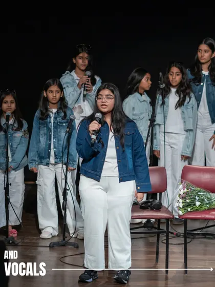 A young vocalist takes the lead, backed by a choir of her fellow students, at 'Holiday in Harmony'. We nurture both solo and group performance skills.