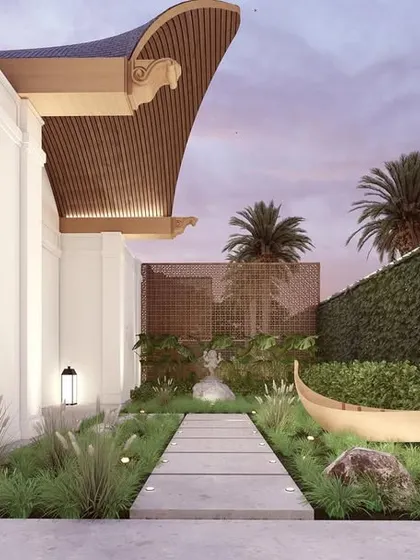A render of the "Kettuvallam" project's serene entryway, featuring a pathway through a lush garden with traditional Kerala-inspired elements. This is the vision we are currently bringing to life.
