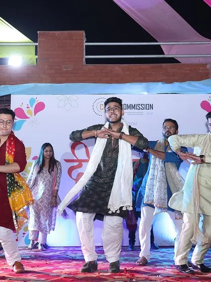 A choreographed team dance performance on stage. I can help organize entertainment and activities that encourage team building and participation.