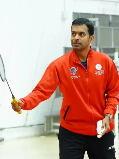 Pullela Gopichand during the inauguration of our first international venture in Qatar, holding a racket and ready to inspire.