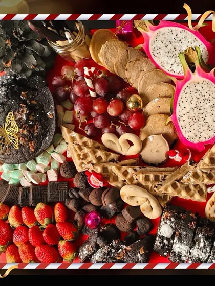 My dessert platters are designed to be the grand finale of your feast. This festive board is a symphony of sweets, featuring exotic dragon fruit, rich chocolate brownies, golden waffles, and fresh strawberries, ensuring there's a delightful treat for every guest.