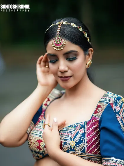 A soft and graceful portrait of a bride, capturing a quiet, candid moment.