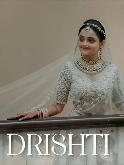 A stunning portrait of the bride, Drishti, looking ethereal in her all-white ensemble. A picture of pure grace.