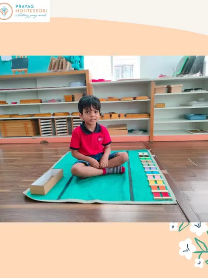This child is carefully arranging the color tablets. This activity requires focus and precision, helping to lengthen his attention span.