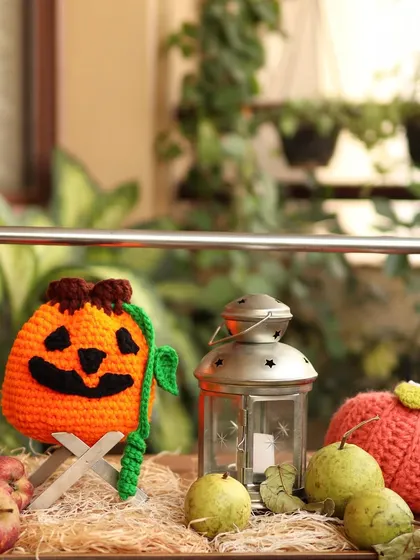 Happy Halloween. A spooky-cute setup with my Jack-o'-lantern pouch and other crochet pumpkins.