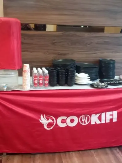 A complete self-service station with a water cooler, glasses, and all necessary disposables, ensuring your guests have everything they need.