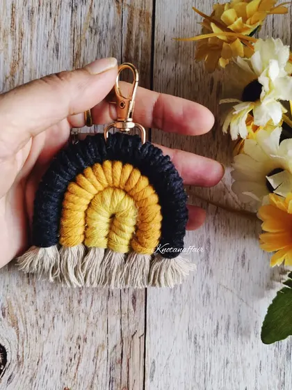 This cute little macrame rainbow keychain in black and yellow is a perfect accessory for someone who loves unique, handmade items. Great as a bridesmaid gift or party favor.