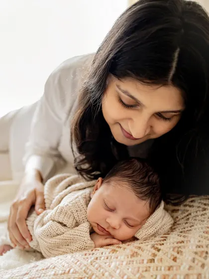 New parents lost in the moment with their sleeping baby. These overhead shots create a beautiful, intimate perspective of your new family.