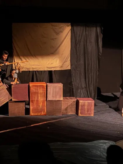 The full stage is used to show the Lilliputians capturing the giant Gulliver. The creative use of simple props and different-sized puppets makes the story come alive.
