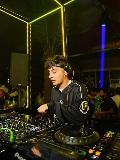 A shot of me mixing inside the neon-lit cube. It was a really cool setup to play in and added a futuristic feel to the whole night.
