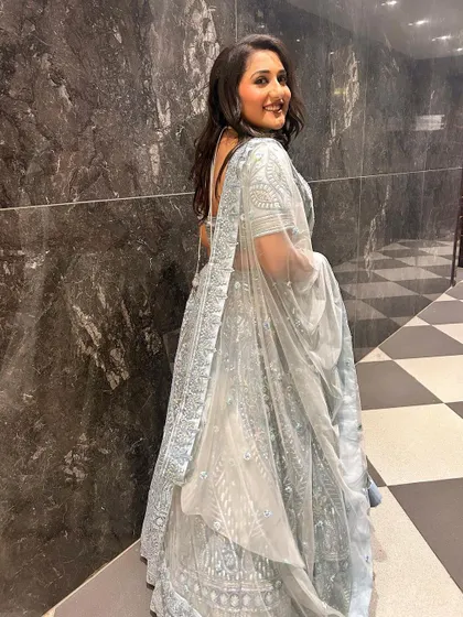 The flow and flare of the lehenga are just as important. This shot shows the beautiful drape of the fabric as she walks.
