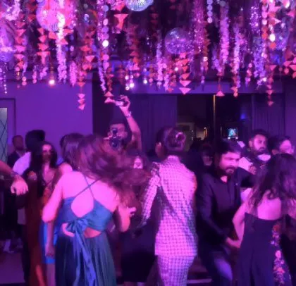 A wedding party attended by actress Shreya Dhanwanthary, with beautiful floral decor.