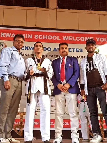 A senior student receiving his gold medal. His leadership and skill are an example to the younger players.