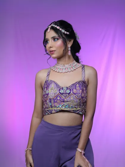 A front view of this pretty party look. The makeup features a colorful eyeshadow blend that complements the pastel jewelry.