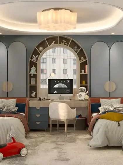 This shared kids' room design includes a central study desk flanked by two beds, with arched wardrobes creating a soft, elegant look.