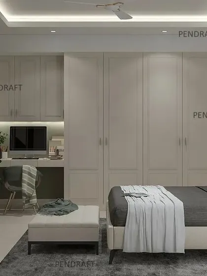 This angle reveals the full wall of seamless wardrobes with a built-in study nook, demonstrating our expertise in creating multi-functional, space-saving modular solutions.