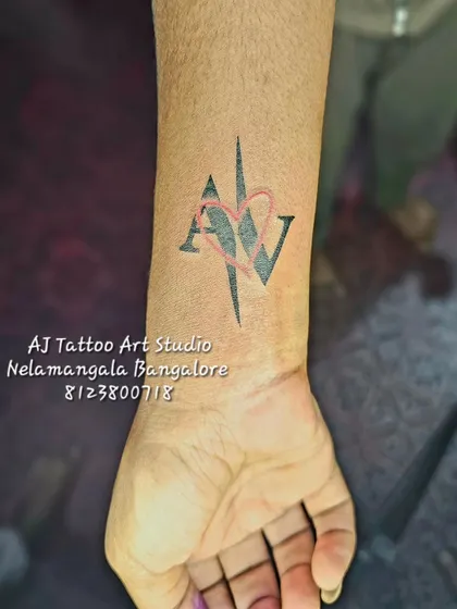 A graphic design of the initials 'A' and 'V' with a heart, perfect for a couple.