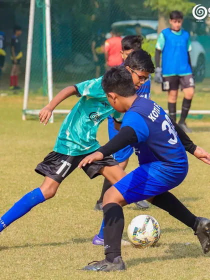 Two players locked in a battle for possession, demonstrating their strength and determination.