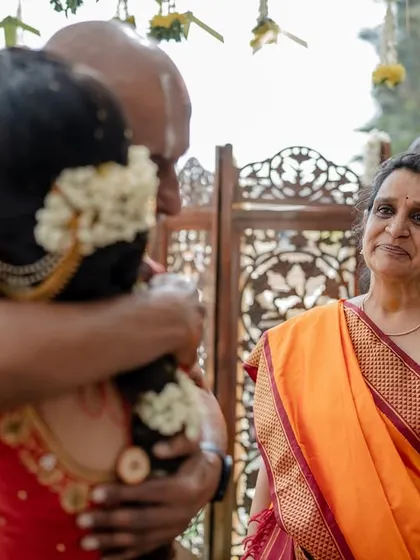 An emotional moment between the bride and her father. These poignant, candid shots are a testament to the deep family bonds that are so central to a wedding.