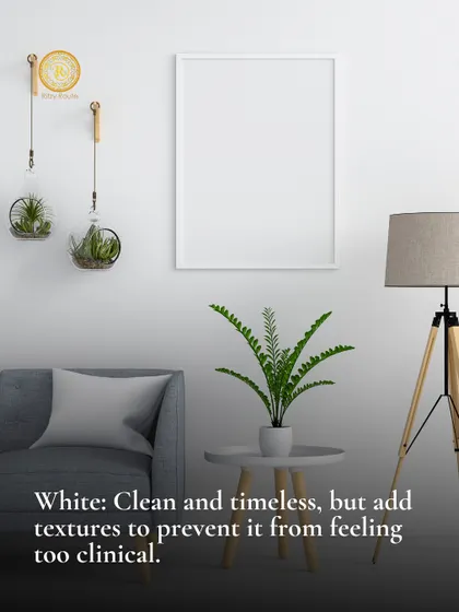White is clean and timeless, but add textures to prevent it from feeling too clinical. A minimalist white living room with plants and a tripod lamp.