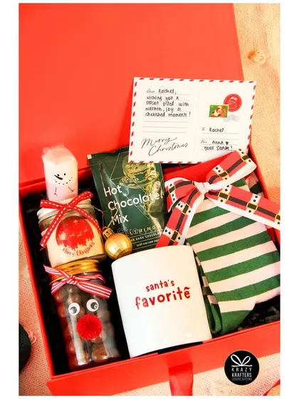 The 'Winter Wonderland' Christmas hamper, filled with festive goodies and a 'Santa's Favorite' mug.