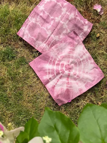 Another view of the finished napkins from our DIY kit, laid out on the grass. It's a perfect weekend activity to relax and create something beautiful.