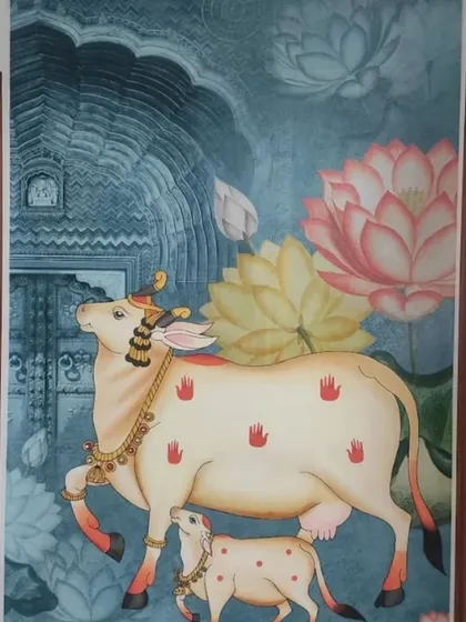 A vibrant Pichwai cow mural installed in a hallway, turning a transitional space into a beautiful art gallery.