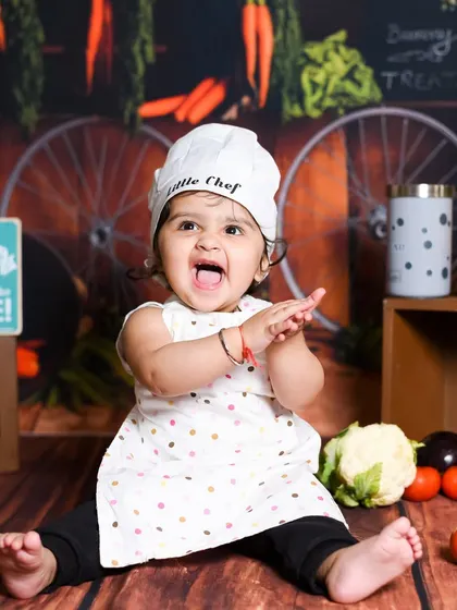 How about a 'Little Chef' for a day? I love creating unique, fun themes for pre-birthday photoshoots, complete with costumes and a full kitchen setup for your child to explore.