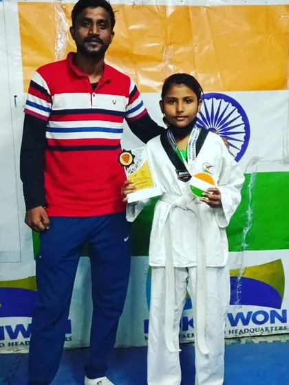 Posing with my student after her win. She fought with great spirit.