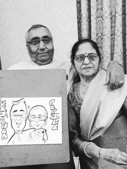 An elderly couple's bond captured in a timeless black and white caricature at an engagement party. It's a privilege to draw guests of all ages.