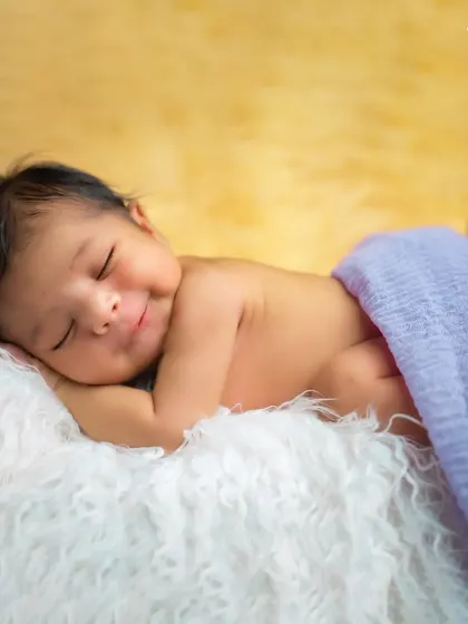 There is nothing more precious than a newborn's smile. We capture these fleeting moments in our cozy studio, ensuring your baby is safe, comfortable, and peacefully asleep for their first infant photoshoot.