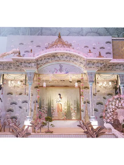 It’s all about the prints, pastels, and patterns. This setting for 'The Eternal Krishna' theme transforms a render into reality, creating a magical Brindavan with intricate backdrops and elegant decor.