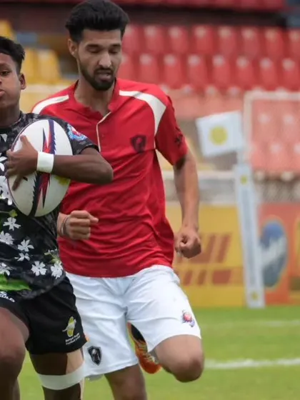 A young player evades a tackle during a national championship match. Moments like these build confidence and showcase the results of dedicated training.