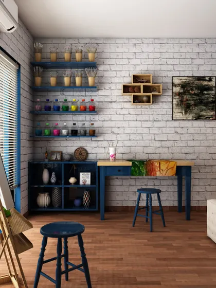 A functional corner in the art studio concept, featuring a work desk and open shelving for paints and supplies. The exposed brick wall adds a rustic, industrial texture to the creative environment.