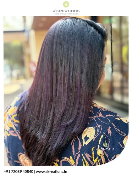 Soft lavender and deep violet highlights woven into dark hair for a subtle yet stunning pop of color.
