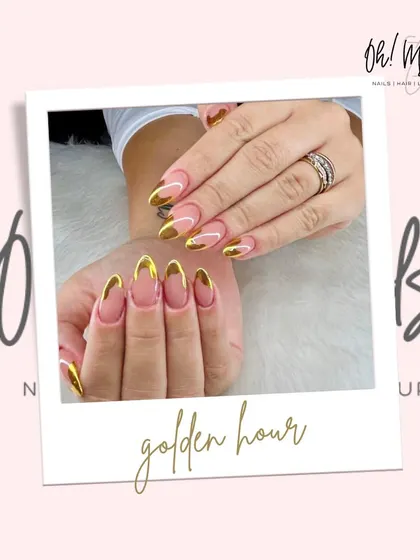 The golden hour trend, captured on your nails. This look combines a clean, transparent base with a striking gold chrome French tip, offering a chic and luxurious style that’s perfect for any occasion, day or night.