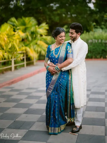 A joyful embrace between Tanuja and Abhishek during their engagement session.