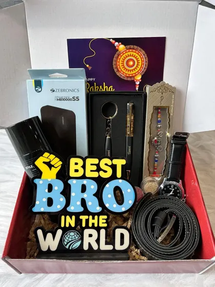 An electronics and accessories hamper for the tech-savvy brother. This box includes a Zebronics power bank, a 'Best Bro' standee, a watch, a belt, a personalized pen and keychain set, and a rakhi.