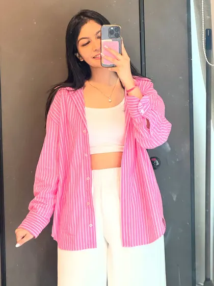 A simple yet chic office fit. I paired a pink striped shirt with a white tank top and trousers for a fresh and modern corporate look.