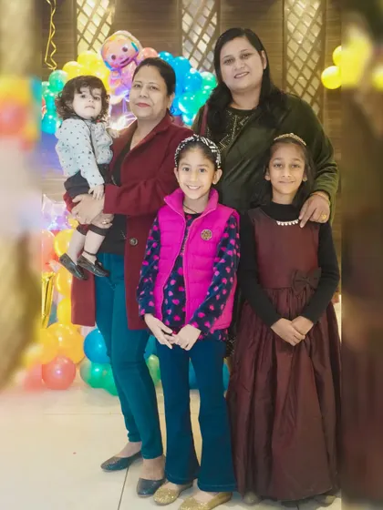 A large group photo of family and friends celebrating a child's birthday together.