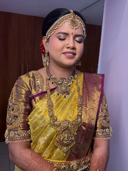 Another angle of the Bale Shastra look, showing the addition of red flowers in the hair which adds a beautiful traditional touch.