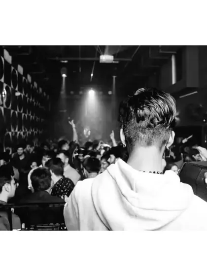 A black and white shot capturing the raw energy of the dance floor. Even without color, the vibe is undeniable.