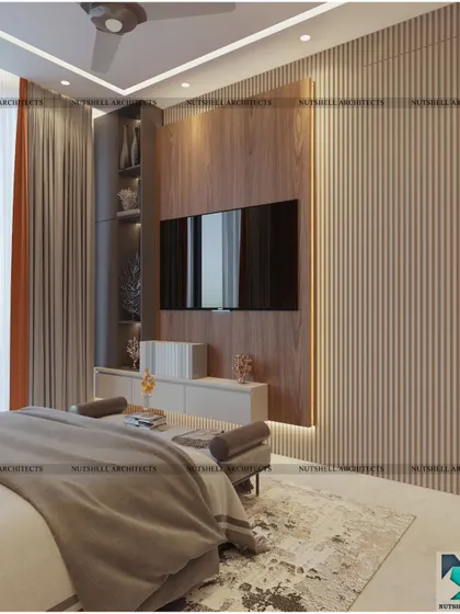 This bedroom design features a striking TV unit with integrated shelving against a backdrop of fluted panels. The warm wood tones and soft backlighting create a cozy and inviting atmosphere.