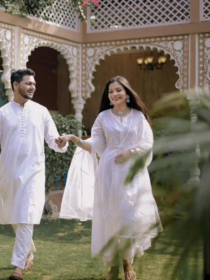 Sahas and Shradha looking elegant in matching white outfits at The Picturedestination. This location offers beautiful architectural backdrops for a classic pre-wedding shoot.