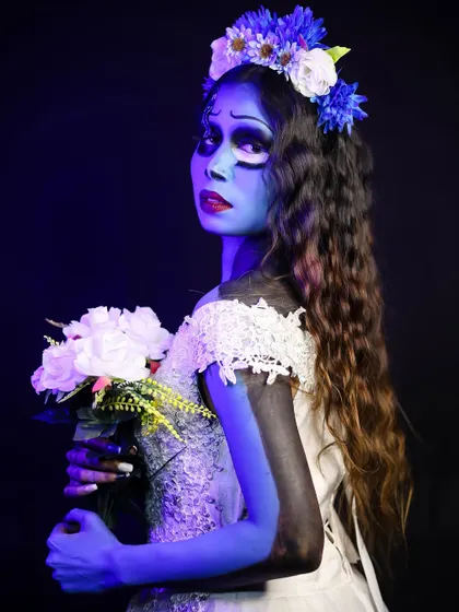 A back view of the Corpse Bride, showing the attention to detail in the hairstyle and costume.