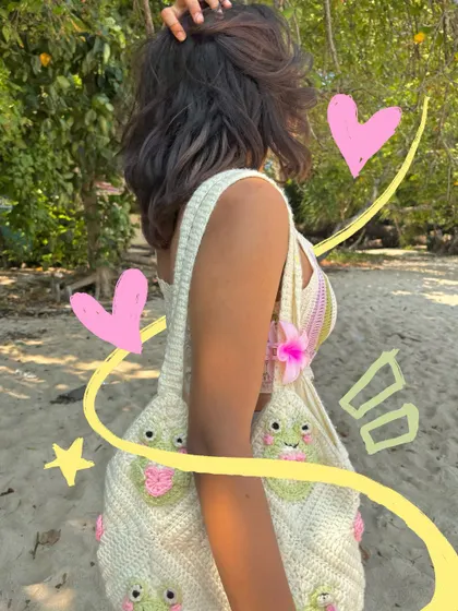 My cute frog crochet bag gets the spotlight with some fun yellow doodles and pink hearts.