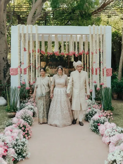 The bride, Kanika, walks down the aisle with her parents. This is a deeply emotional and significant moment that I am always honored to capture.