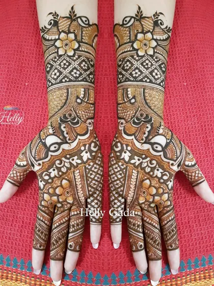 A beautiful blend of floral and traditional patterns. This full-hand design features delicate flowers mixed with classic peacock motifs and geometric grids, creating a rich and varied texture.